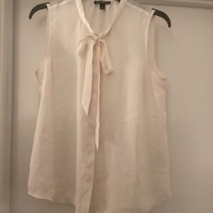 Cream color sleevless blouse with a neck tie